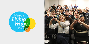 Living Wage Employer Accreditation with a picture of the Agilitas team sat making love hearts with their hands